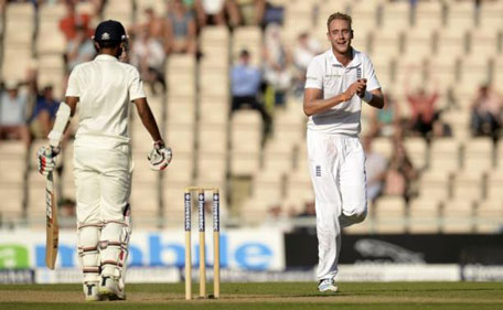 England's Stuart Broad celebrates after the dismissal of India's Bhuvneshwar Kumar (left) during the third Test at the Rose Bowl cricket ground in Southampton, England July 29, 2014. (REUTERS)