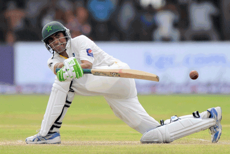 Pakistan cricketer Younis Khan plays a shot during the first day of the opening Test match between Sri Lanka and Pakistan at the Galle International cricket Stadium in Galle on August 6, 2014. (AFP)