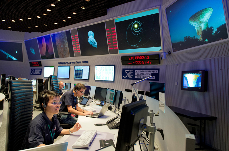Scientists follow the flight of the Rosetta spacecraft from the control centre of the European Space Agency (ESA) in Darmstadt, western Germany, on August 6. (AFP)