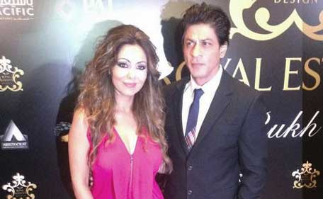 Bollywood superstar Shah Rukh Khan poses along with wife Gauri Khan during the launched of Dh2.3-billion Royal Estates project in Dubai Investments Park, August 6, 2014. (Twitter: THE KINGs CLUB ‏@SRKFC1)