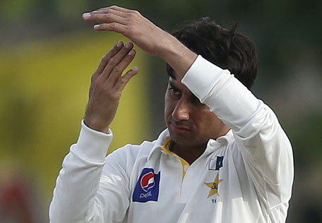 Pakistan's Saeed Ajmal signals the third umpire review for an unsuccessful wicket of Sri Lanka's Rangana Herath (not pictured) during the fourth day of their first Test in Galle August 9, 2014.  (REUTERS)