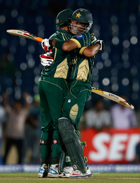 Pakistan's Sohaib Maqsood (R), who scored 89 runs, celebrates with teammate Shahid Afridi after they won their first ODI (One Day International) cricket match against Sri Lanka in Hambantota August 23, 2014.  (REUTERS)