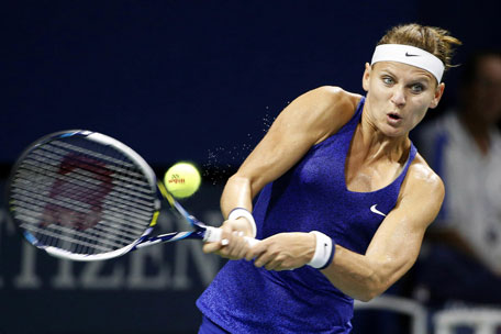 Lucie Safarova, of Czech Republic, returns a shot to Shuai Peng, of China, during the fourth round of the US Open tennis tournament Sunday, Aug. 31, 2014, in New York. (AP)