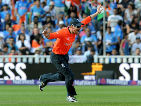 England's Eoin Morgan celebrates after India's Ajinkya Rahane was bowled by Moeen Al for 8 runs during the International T20 match at Edgbaston cricket ground, Birmingham, England, Sunday Sept. 7, 2014. (AP)