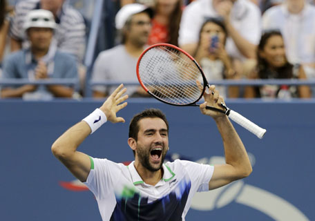 Marin Cilic of Croatia reacts after defeating Roger Federer during the semifinals of the 2014 US Open tennis tournament, Saturday, Sept. 6, 2014, in New York. (AP)