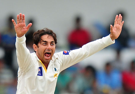 In this photograph taken on August 17, 2014, Pakistan bowler Saeed Ajmal successfully appeals for the wicket of Sri Lankan batsman Dhammika Prasad during the fourth day of the second Test match between Sri Lanka and Pakistan at the Sinhalese Sports Club (SSC) Ground in Colombo. (AFP)