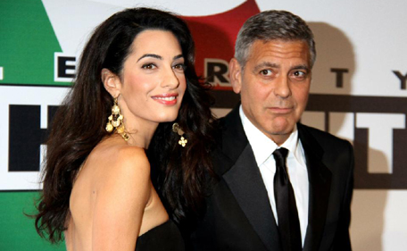 George Clooney and his fiancee Amal Alamuddin at an event in Florence, Italy on September 7, 2014 (AFP)