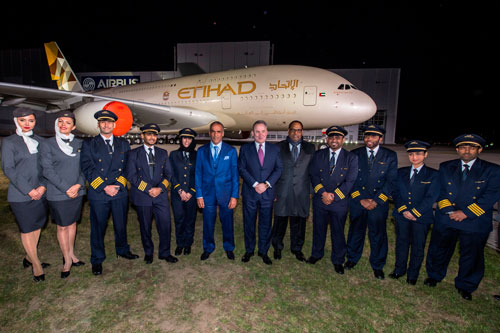 Etihad Airways cabin crew and pilots celebrate unveiling of the airline’s new livery. Sheikh Dr. Hamed Al Hamed, Etihad Airways board member (centre left); James Hogan, Etihad Airways’ President and Chief Executive Officer (centre); Jumaa Mubarak Al Junaibi, UAE Ambassador to Germany (centre right) pose with the Etihad aircraft (SUPPLIED)