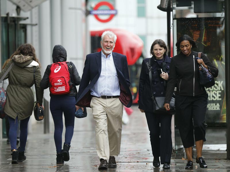 Professor John O'Keefe (centre) walks along Euston Road on his way to a news conference in London October 6, 2014. (Rueters)