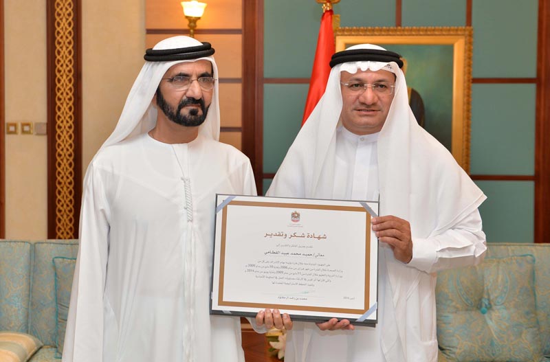 His Highness Sheikh Mohammed bin Rashid Al Maktoum, Vice-President and Prime Minister of the UAE and Ruler of Dubai, honouring a former UAE government official on Sunday. (Wam)
