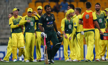 Pakistani batsman Sarfraz Ahmed leaves the pitch after he was caught out during the third One Day International (ODI) cricket match against Australia in Abu Dhabi on October 12, 2014. (AFP)