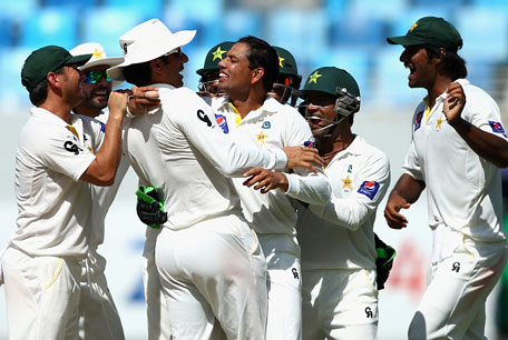 Zulfiqar Babar of Pakistan celebrates after taking the wicket of Brad Haddin of Australia during Day Five of the First Test between Pakistan and Australia at Dubai International Stadium on October 26, 2014 in Dubai, UAE. (GETTY)