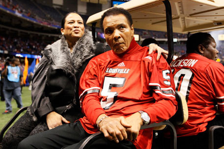 Boxing legend Muhammad Ali rides a golf cart onto the field to represent the Louisville Cardinals for the coin toss against the Florida Gators prior to the start of the Allstate Sugar Bowl at Mercedes-Benz Superdome on January 2, 2013 in New Orleans, Louisiana. (GETTY)