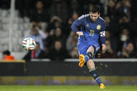 Argentina striker Lionel Messi takes a free kick during the international friendly between Croatia and Argentina at the Boleyn Ground, Upton Park, in London on November 12, 2014. (AFP)