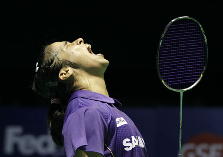 Saina Nehwal of India celebrates after beating Akane Yamaguchi of Japan to win the women's singles title match at the Badminton China Open in Fuzhou, China's Fujian province on November 16, 2014. (AFP)
