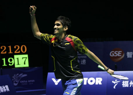 K. Srikanth of India celebrates after beating Lin Dan of China to win the men's singles title at the Badminton China Open in Fuzhou, China's Fujian province on November 16, 2014. (AFP)