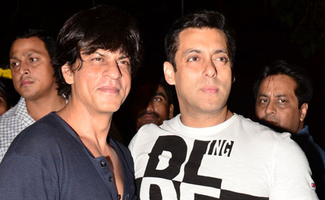 Bollywood actors Shah Rukh Khan (L) and Salman Khan pose for photographers. (Sanskriti Media and Entertainment)