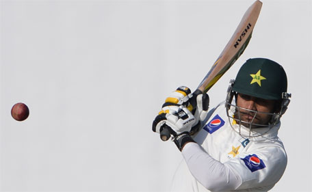 Pakistani batsman Mohammad Hafeez plays a shot during the first day of the third and final Test match between Pakistan and New Zealand at the Sharjah cricket stadium in Sharjah on November 26, 2014. (AFP)