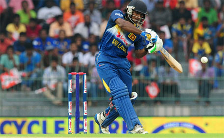 Sri Lankan cricketer Kusal Perera plays a shot during the first One Day International (ODI) match between Sri Lanka and England at the R. Premadasa Cricket Stadium in Colombo on November 26, 2014. (AFP)