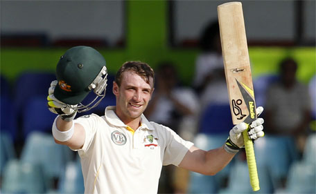 In this Sept. 19, 2011 file photo Australia's batsman Phillip Hughes celebrates after scoring a century during the fourth days' play of the third cricket test match between Australia and Sri Lanka in Colombo, Sri Lanka. (AP)