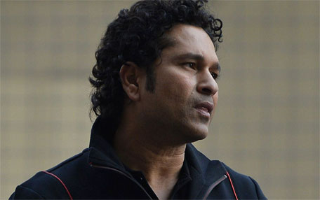 Former Indian cricketer Sachin Tendulkar looks on during a promotional event for an automaker at the Buddh International Circuit in Greater Noida, on the outskirts of New Delhi on November 27, 2014. (AFP)