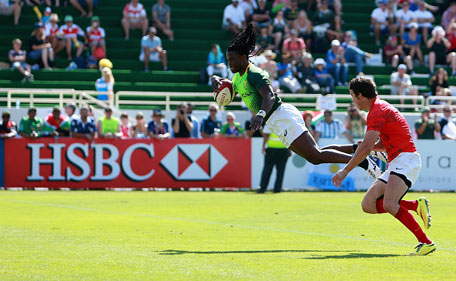 Seabelo Senatla of South Africa dives to score a try against Argentina in the Cup Quarter Final during day two of the Emirates Dubai Sevens - HSBC Sevens World Series at The Sevens Stadium on December 6, 2014 in Dubai, UAE. (Getty)