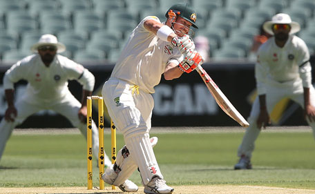 David Warner of Australia hits the ball to the boundary off Mohammed Shami of India on day one of the First Test between Australia and India at Adelaide Oval on December 9, 2014 in Adelaide, Australia. (Getty)