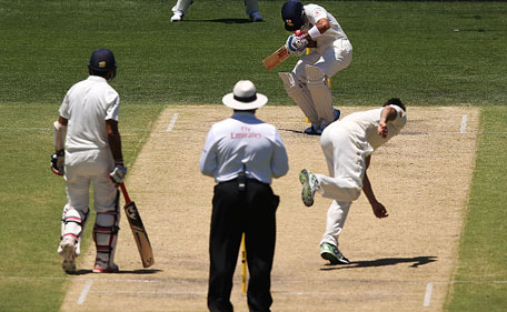 Mitchell Johnson of Australia bowls the ball and hits Virat Kohli of India on the helmet during day three of the First Test between Australia and India at Adelaide Oval on December 11, 2014 in Adelaide, Australia. (Getty)