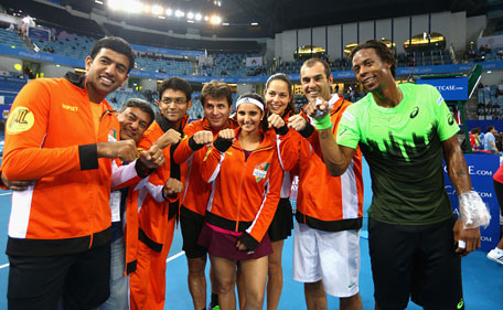 The Indian Aces pose for a group photograph after their victory against the Singapore Slammers during the Coca-Cola International Premier Tennis League fourth leg at the Hamdan Sports Complex, December 10, 2014 in Dubai. (Getty)