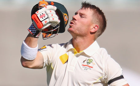 David Warner of Australia kisses his helmet as he celebrates during day four of the first Test between Australia and India at the Adelaide Oval on December 12, 2014 in Adelaide, Australia. (Getty)