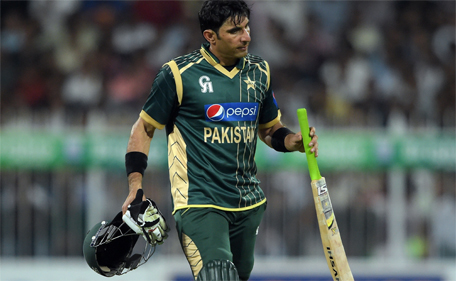 This photograph taken on December 12, 2014 shows Pakistan captain Misbah-ul-Haq react as he leaves the ground after his dismissal during the second one-day international between Pakistan and New Zealand at the Sharjah cricket stadium in Sharjah. (AFP)