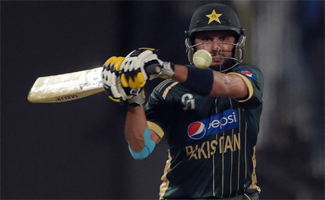 Pakistani batsman Shahid Afridi plays a shot during the second one-day international between Pakistan and New Zealand at the Sharjah cricket stadium in Sharjah on December 12, 2014. (AFP)