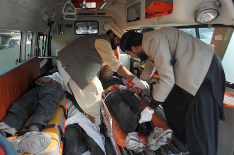 Men move bodies of students, who were killed during an attack by Taliban gunmen on the Army Public School, in an ambulance outside a hospital in Peshawar, December 16, 2014. Taliban gunmen in Pakistan took hundreds of students and teachers hostage on Tuesday in a school in the northwestern city of Peshawar, military officials said.  REUTERS
