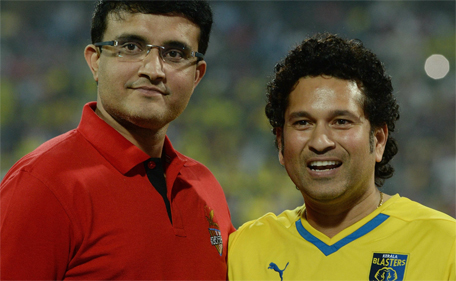 Indian cricketers Sachin Tendulkar (right) and Saurav Ganguly pose before the start of the Indian Super League (ISL) final between Kerala Blasters and Atletico de Kolkata at The D.Y. Patil stadium in Navi Mumbai on December 20, 2014. (AFP)