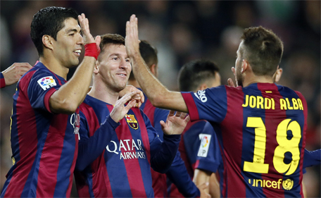 Barcelona's Lionel Messi (centre), Luis Suarez (left) and Jordi Alba celebrate a goal against Cordoba during their Spanish First division soccer match at Camp Nou stadium in Barcelona December 20, 2014. (Reuters)