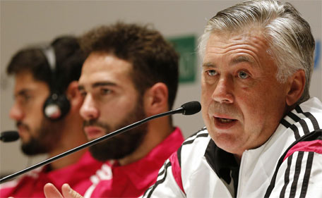 Real Madrid's Italian coach Carlo Ancelotti (right) and defender Daniel Carvajal hold a press conference in Dubai on December 29, 2014, ahead of their friendly football match against AC Milan. (AFP)