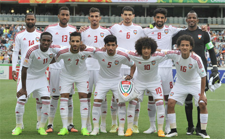 The UAE team poses for a group photo during the sixth round Asian Cup football match between UAE and Qatar in Canberra on January 11, 2015. (AFP)