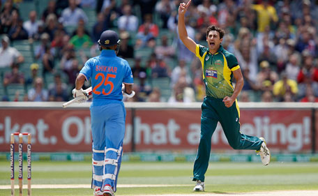 Mitchell Starc of Australia celebrates taking the wicket of Shikhar Dhawan of India during the one-day international between Australia and India at Melbourne Cricket Ground on January 18, 2015 in Melbourne, Australia. (Getty)