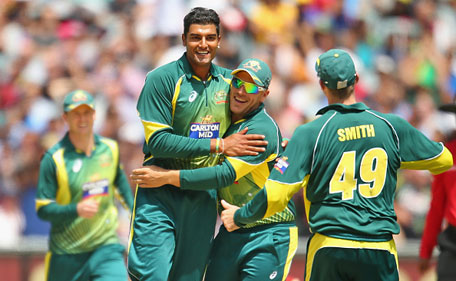 Gurinder Sandhu of Australia celebrates with his teammates after dismissing Ajinkya Rahane of India during the one-day international between Australia and India at the Melbourne Cricket Ground on January 18, 2015 in Melbourne, Australia. (Getty)