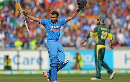 Rohit Sharma of India celebrates his century as Glenn Maxwell of Australia looks on during the one-day international between Australia and India at the Melbourne Cricket Ground on January 18, 2015 in Melbourne, Australia. (Getty)