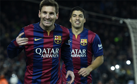 Barcelona's Lionel Messi celebrates after scoring a goal during the Spanish Copa del Rey (King's Cup) quarter-final first leg football match FC Barcelona vs Atletico de Madrid at the Camp Nou stadium in Barcelona on January 8, 2015. (AFP)