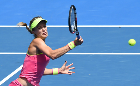 Eugenie Bouchard of Canada hits a return against Irina-Camelia Begu of Romania in their women's singles match on day seven of the 2015 Australian Open tennis tournament in Melbourne on January 25, 2015. (AFP)
