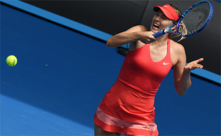 Maria Sharapova of Russia hits a return against Peng Shuai of China in their women's singles match on day seven of the 2015 Australian Open tennis tournament in Melbourne on January 25, 2015. (AFP)