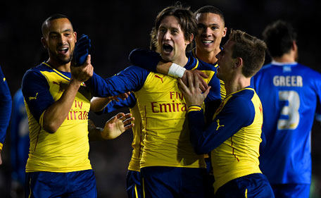 Tomas Rosicky of Arsenal celebrates with team-mates after scoring his team's third goal during the FA Cup Fourth Round match between Brighton & Hove Albion and Arsenal at Amex Stadium on January 25, 2015 in Brighton, England. (Getty)