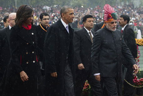 Indian Prime Minister Narendra Modi (R) escorts US President Barack Obama (C) and First Lady Michelle Obama (L) as they arrive to attend India's Republic Day Parade in New Delhi on January 26, 2015. Barack Obama will become the first US president to be chief guest at India's Republic Day parade on January 26, a day after hailing a new era of friendship between the world's biggest democracies. (AFP)