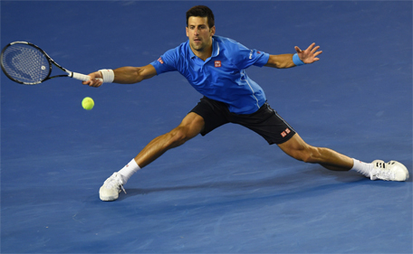 Serbia's Novak Djokovic hits a return against Luxembourg's Gilles Muller during their men's singles match on day eight of the 2015 Australian Open tennis tournament in Melbourne on January 26, 2015. (AFP)