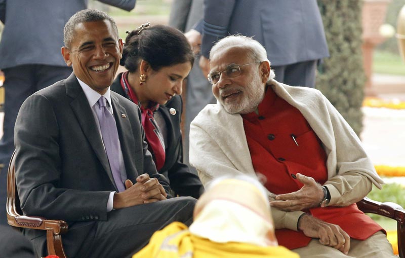 US President Barack Obama laughs as he talks with India's Prime Minister Narendra Modi (R) at a 'home reception' with several hundred Indian political and cultural figures at the Rashtrapati Bhavan presidential palace in New Delhi January 26, 2015. (Reuters)