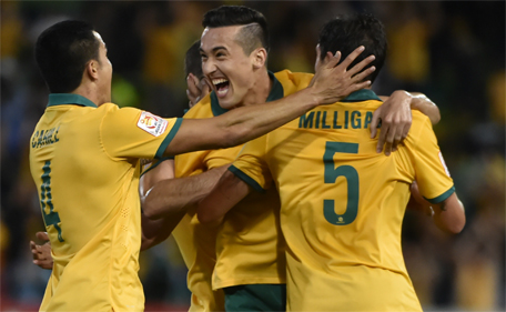 Jason Davidson (centre) of Australia celebrates scoring the second goal against United Arab Emirates in their AFC Asian Cup semi-final in Newcastle on January 27, 2015. (AFP)