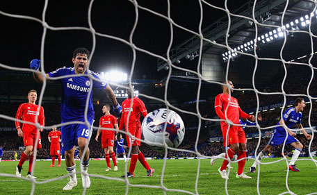 Diego Costa of Chelsea kicks the ball in the back of the net to celebrate after Branislav Ivanovic of Chelsea scored the opening goal during the Capital One Cup Semi-Final second leg between Chelsea and Liverpool at Stamford Bridge on January 27, 2015 in London, England. (Getty)