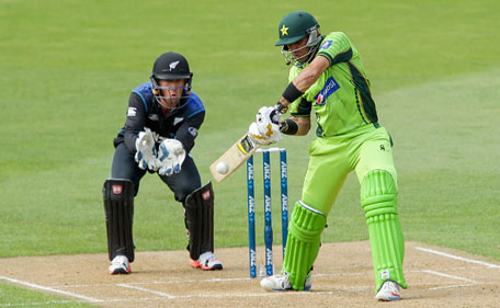 Misbah-ul-Haq of Pakistan bats while Luke Ronchi of New Zealand looks on during the One Day International  between New Zealand and Pakistan at Westpac Stadium on January 31, 2015 in Wellington, New Zealand. (Getty)